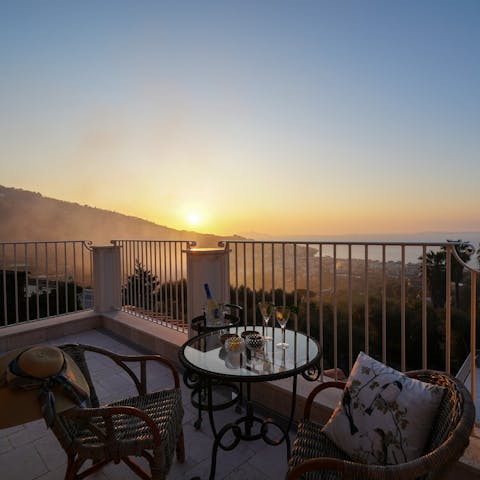 Enjoy a sunset beverage on the upper terrace