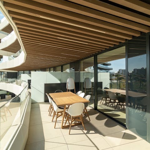 Share some paella and tapas on the cute table on the balcony