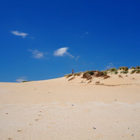 Head to the nearby beaches, known for their golden sands and popular with kite surfers