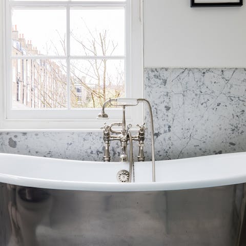 Sink a little deeper in the opulent roll-top bathtub