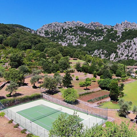 Wander the sprawling grounds and find the tennis court tucked away