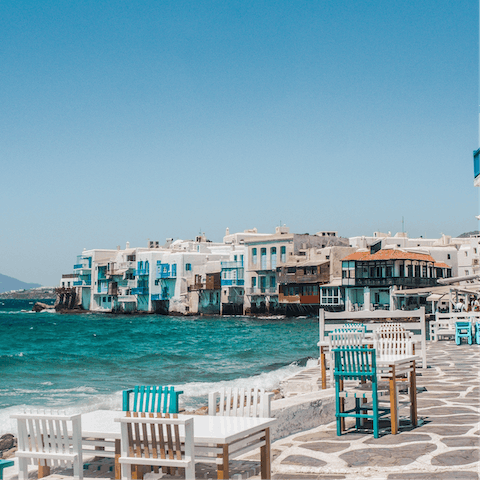 Wind your way through the old town of Mykonos and find the perfect spot for sunset drinks