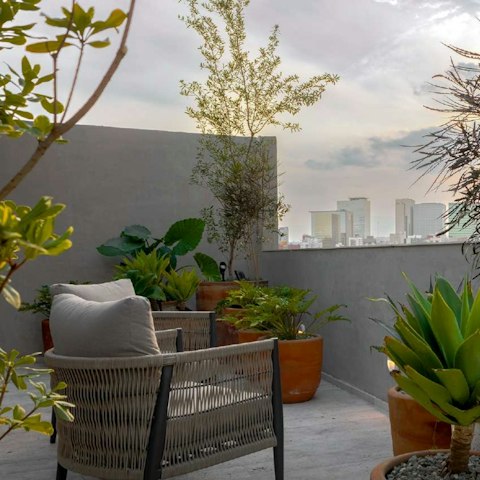 Relax on the shared roof terrace as you enjoy the view