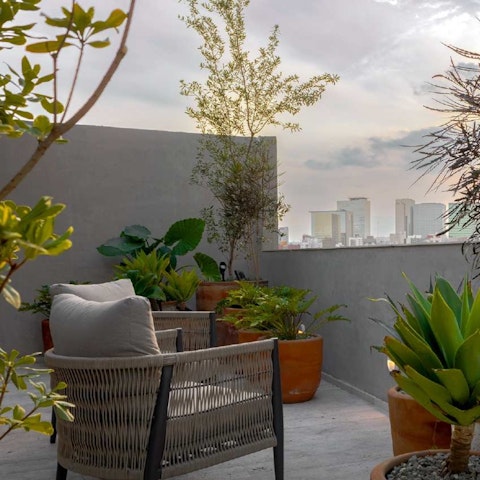 Relax on the shared roof terrace as you enjoy the view