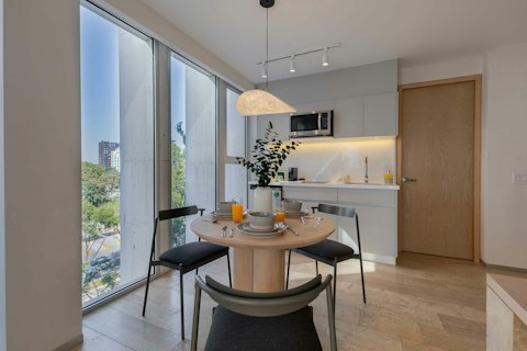 Dine beside floor-to-ceiling windows with city vistas
