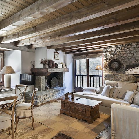 Gather around the fireplace in the living room with a hot drink after the slopes