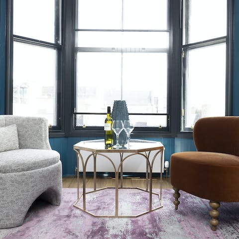 Sip a evening glass of wine and look out over the city below