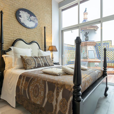 Get some rest in the four-poster bed after a busy day in Seville