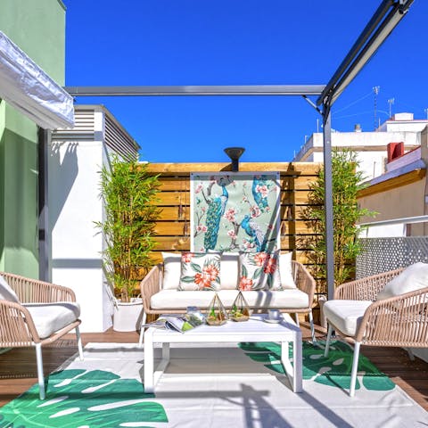 Savour a cool glass of white wine on the sun-drenched terrace