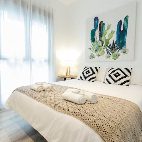 Wake up from a restful night's sleep in your minimal bedroom