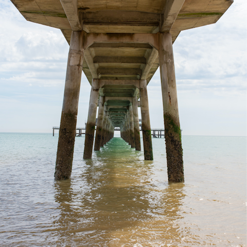 Breathe in the sea air as you stroll along Deal Pier