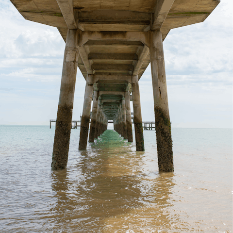 Breathe in the sea air as you stroll along Deal Pier