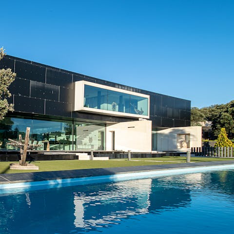 Swim lengths in the crystalline waters of the outdoor pool