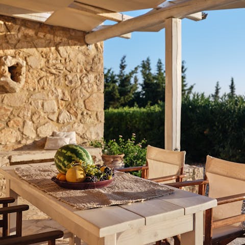 Serve up local Greek delicacies including local olives and wine at the alfresco dining area