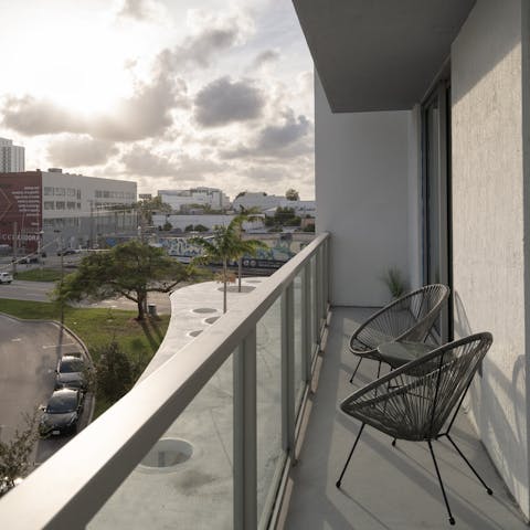 Take in the views across the city from the private balcony