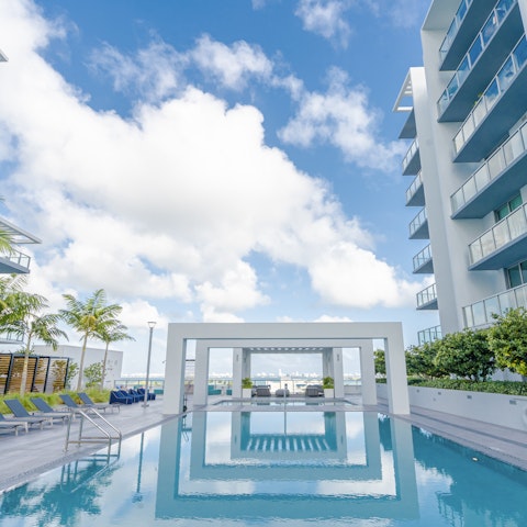 Unwind in the Florida sunshine next to the shared pool