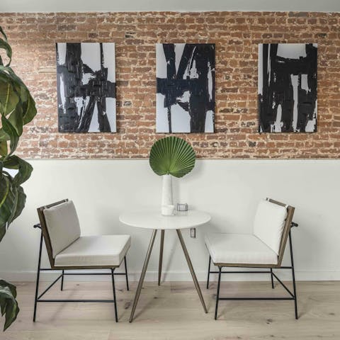 Nibble on bagels in front of the exposed brick