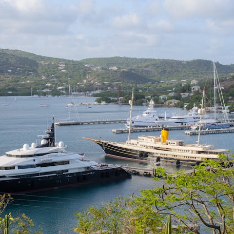 Stay in English Harbour and watch the yachts and boats drift in and out