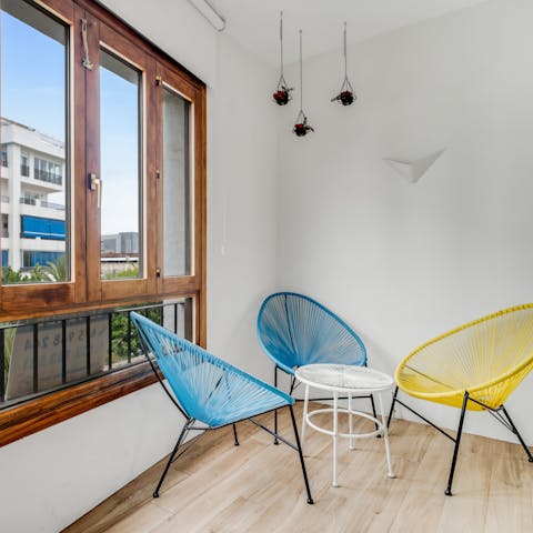 Relax on the Acapulcos with a glass of something chilled in hand