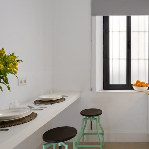 Enjoy a home cooked meal for two in your light filled kitchen cum dining space