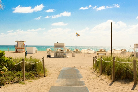 Stroll Hollywood Beach Broadwalk, a seven-minute drive away