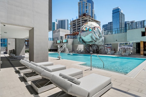 Cool off in the shared pool beneath the downtown Miami skyline