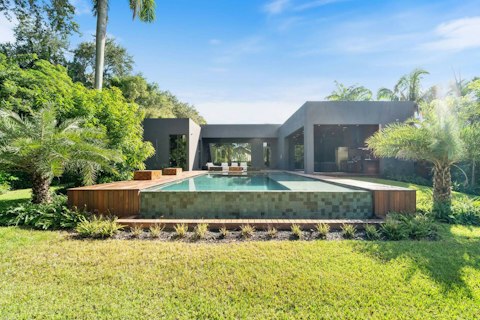 Cool off in the lap pool surrounded by tropical greenery