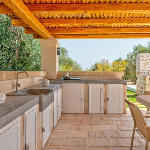 Cook some Italian food in the outdoor kitchen