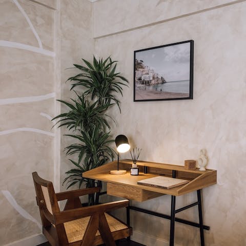 Catch up on work emails at the desk in the living area