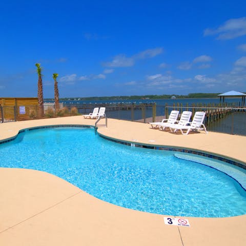 Relax in the sunshine by the communal pool