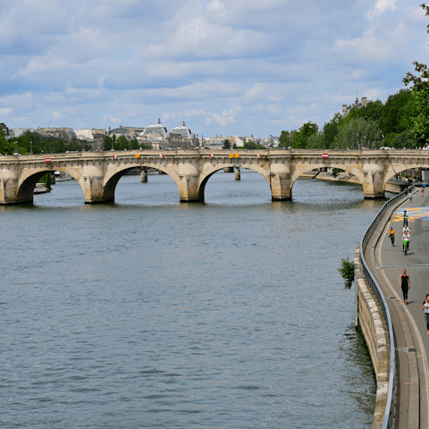 Enjoy leisurely afternoon strolls alongside the Seine