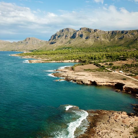 Wander sandy beaches and explore sheltered coves in Mallorca