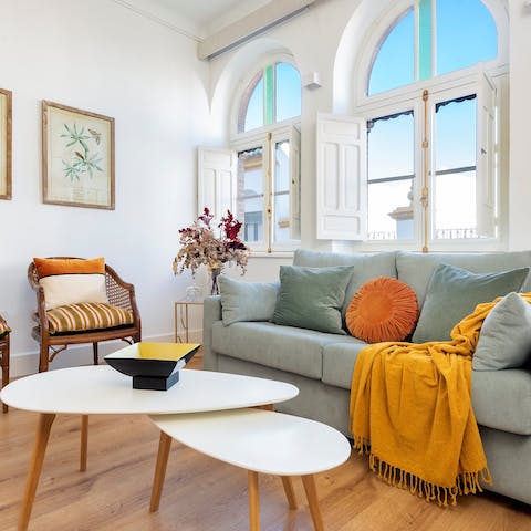 Relax with a glass of Spanish wine in the colourful living area