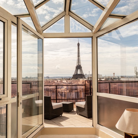 Drink in unobstructed Eiffel Tower views from the balcony