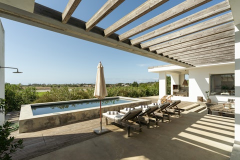 Stretch out poolside as open countryside unfolds beyond