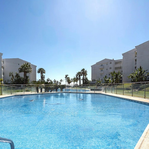 Take a refreshing dip in the shared swimming pool