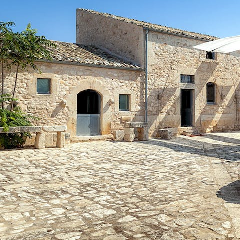 Soak up the home's stunning architecture from the courtyard