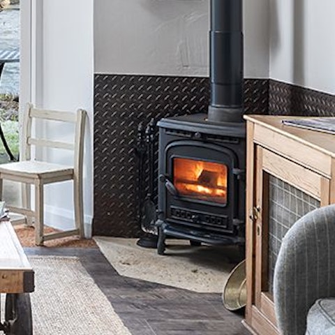 Curl up in front of the wood-burning fire