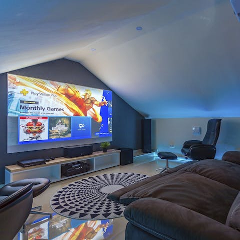 Get cosy in the home cinema room