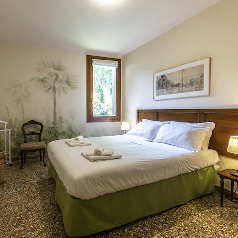 Enjoy a restful night's sleep in the charming green-toned bedroom