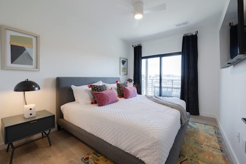 Wake up to sweeping city views from a well-dressed bedroom