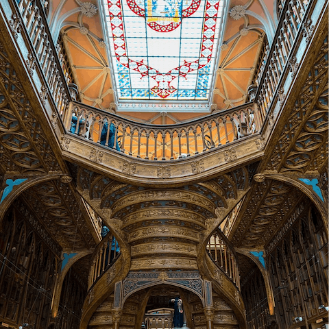 Admire Livraria Lello's ornate interiors, twenty minutes away on foot