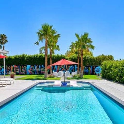 Swim a few up and downs in the glistening, palm-lined pool