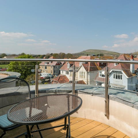 Watch the coastal sunset on the private roof terrace