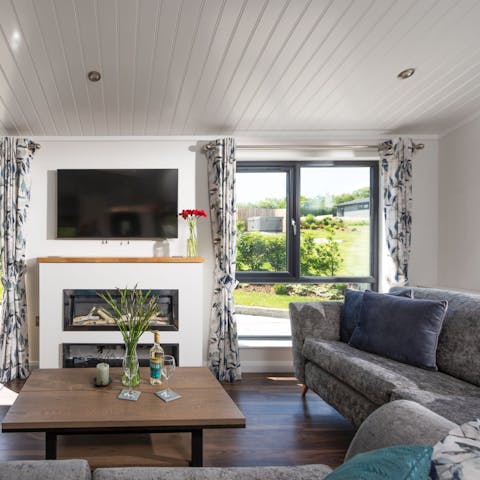 Curl up beside the fire for cosy film nights after long country strolls