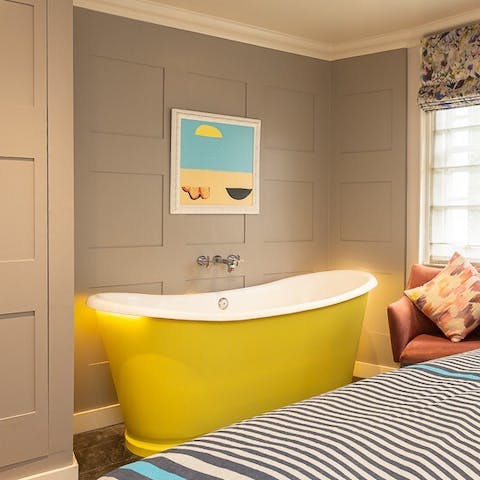Treat yourself to an indulgent bubble bath in the freestanding tub