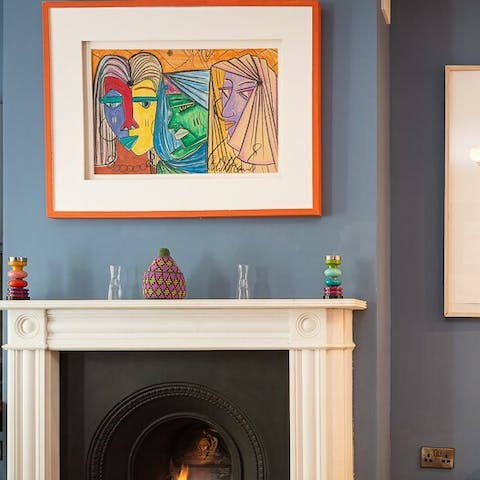 Admire the home's vibrant artwork as you settle down at the dining table