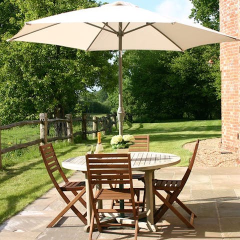 Enjoy a local beer in the garden surrounded by paddocks and fields