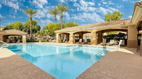 Cool off in the shared pool beneath sunny Arizona skies