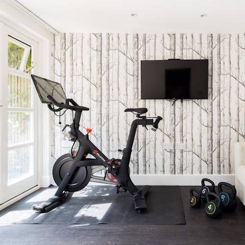 Break sweat on the Peloton bike in the workout room